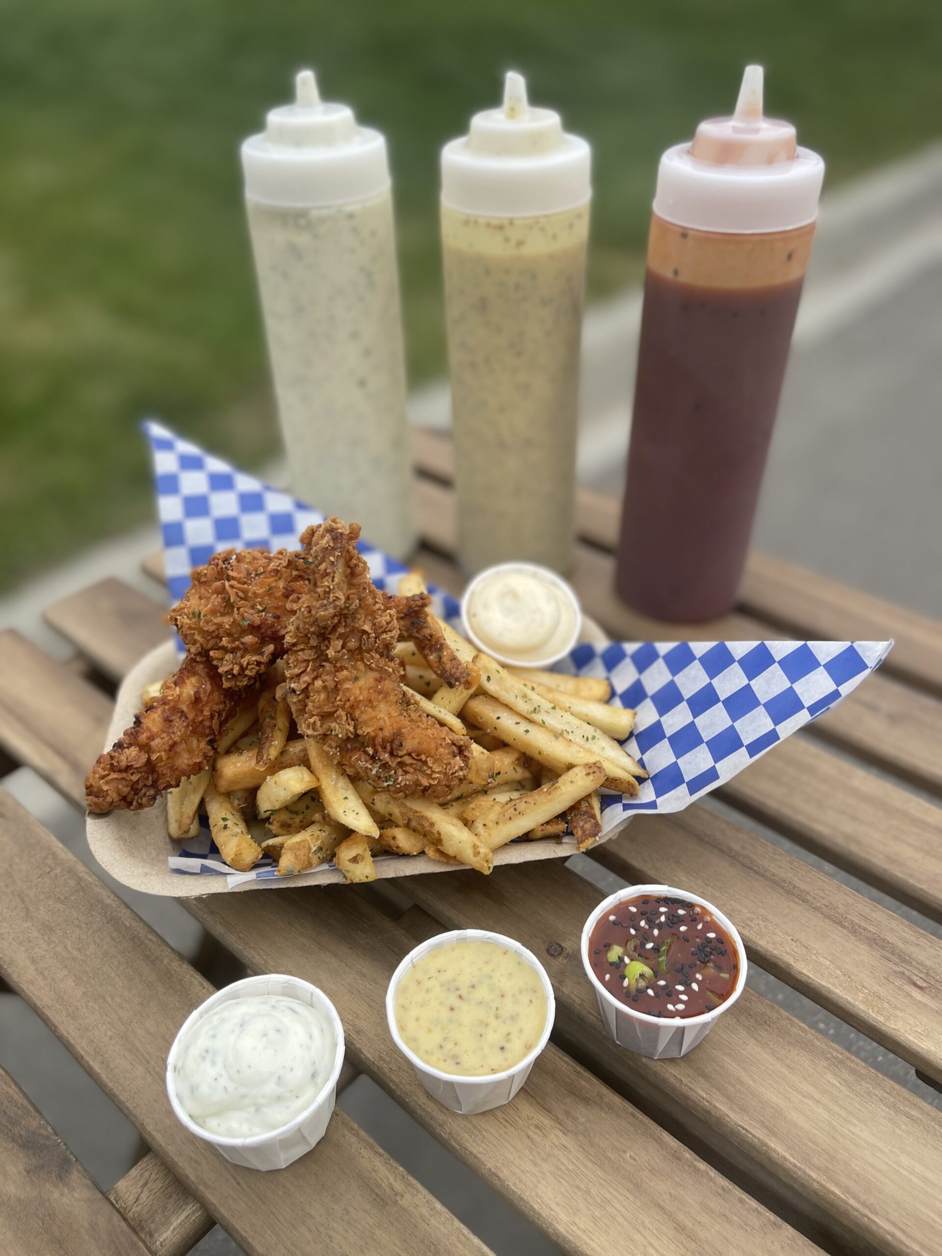 Buttermilk fried chicken strips with fries and house-made sauces